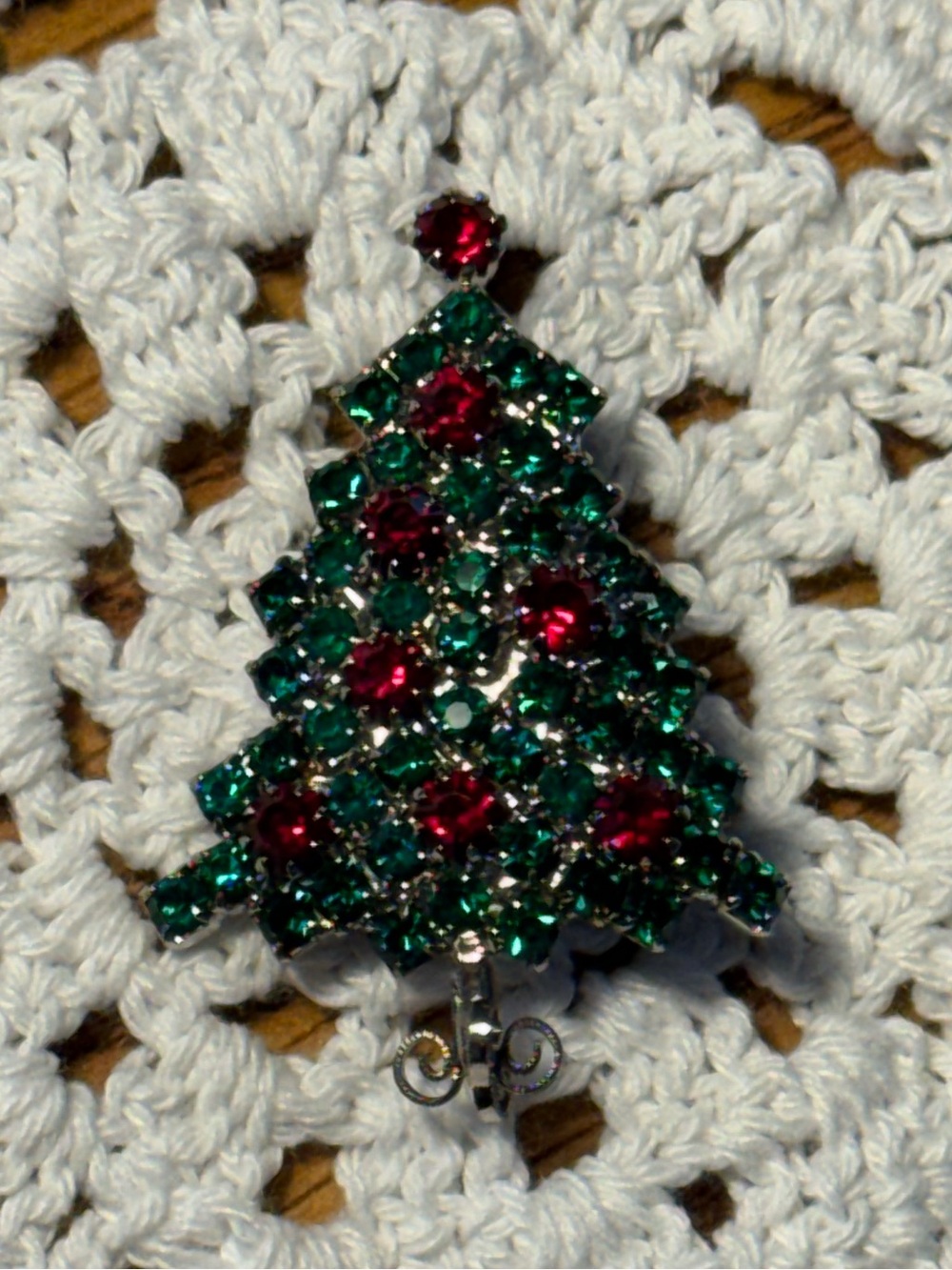 vintage silver-tone Christmas tree brooch with vibrant green and red rhinestones